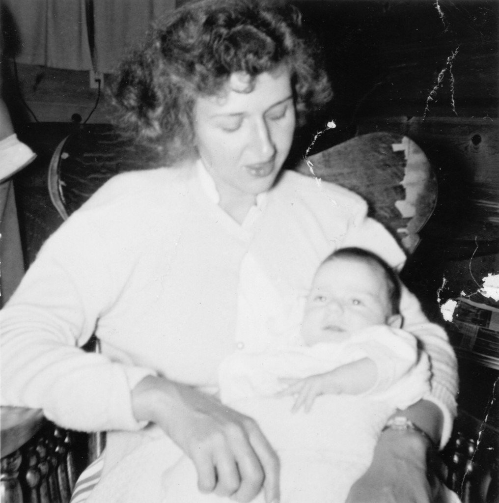 Mary Anderson née Livernois holding first-born son Mark.
Date: July 1953